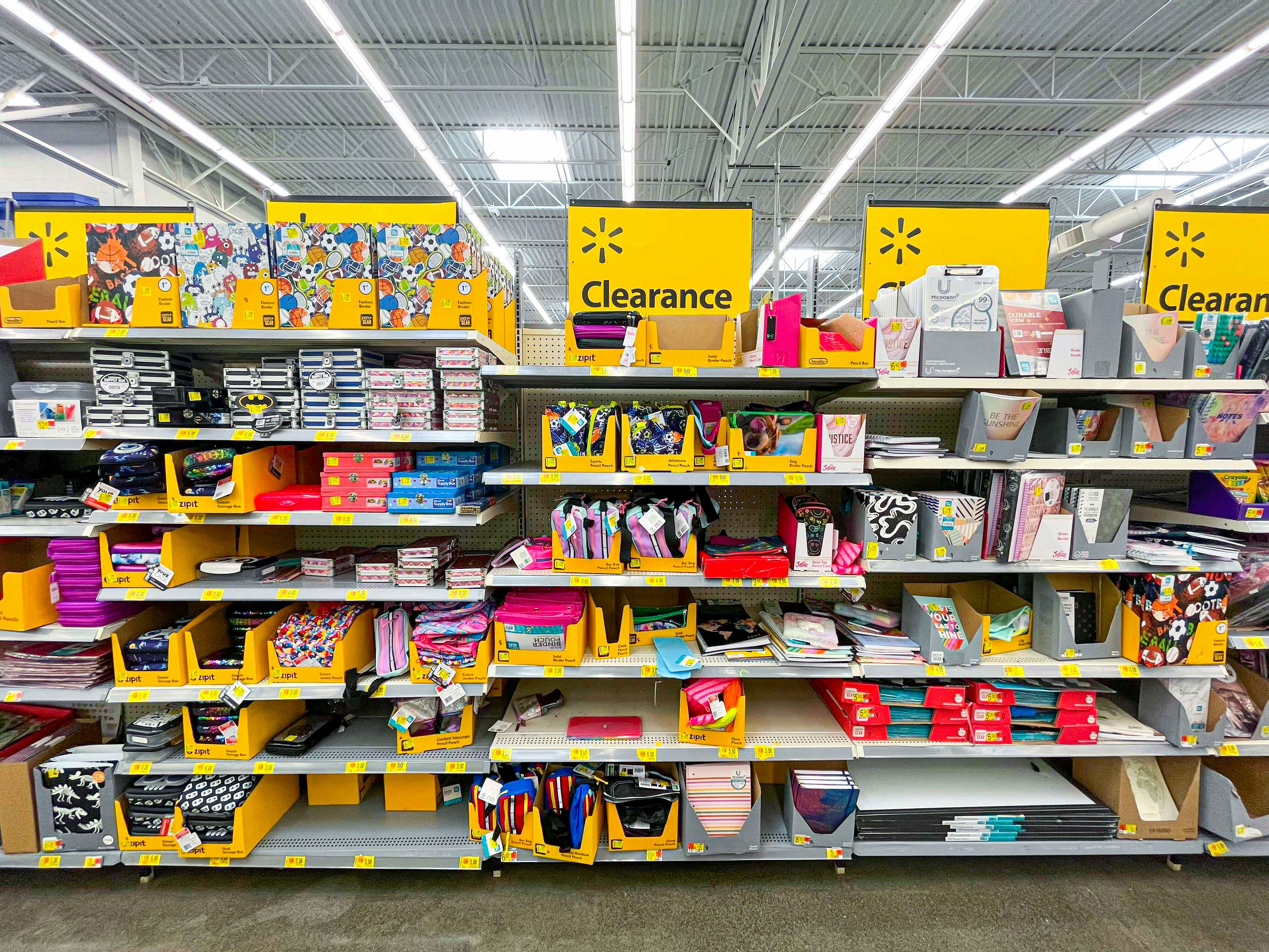 A walmart back-to-school clearance shelf filled with school supplies in store