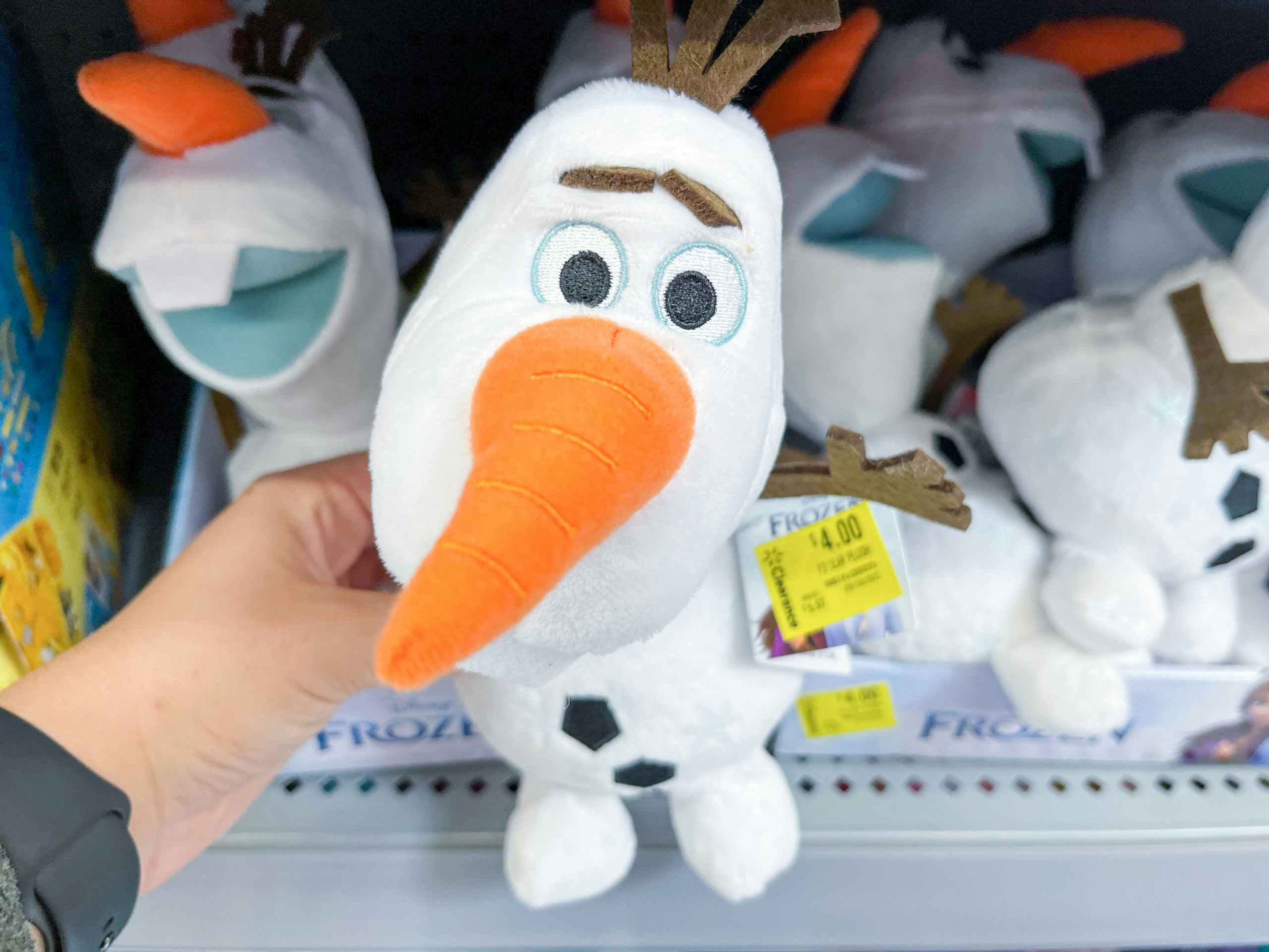 hand holding olaf plush