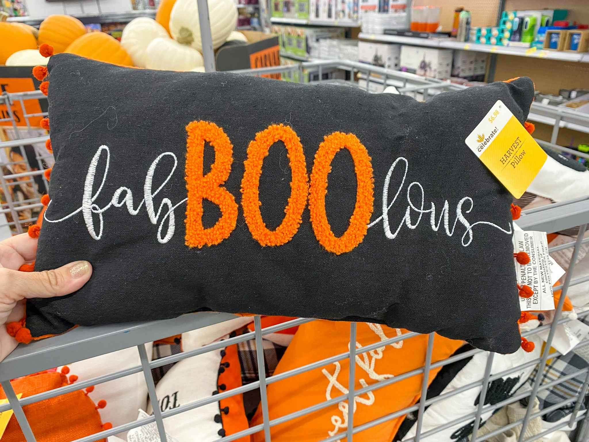 hand holding halloween pillow fab boo lous at walmart