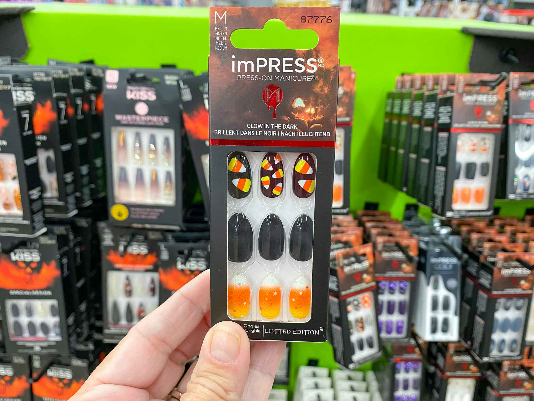 hand holding kiss halloween candy corn press on nails at walmart