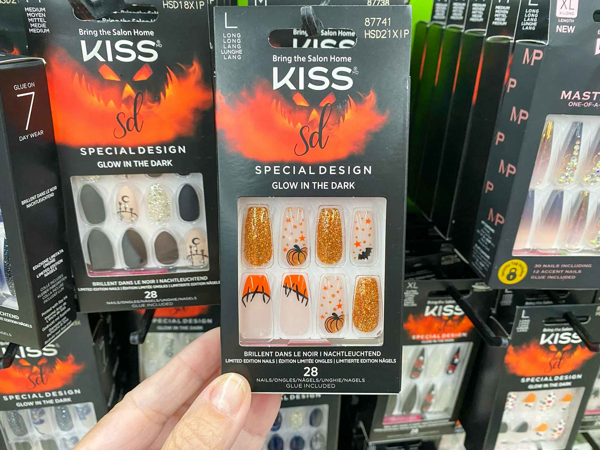 hand holding kiss halloween pumpkin nails at walmart