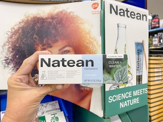 hand holding natean toothpaste at walmart
