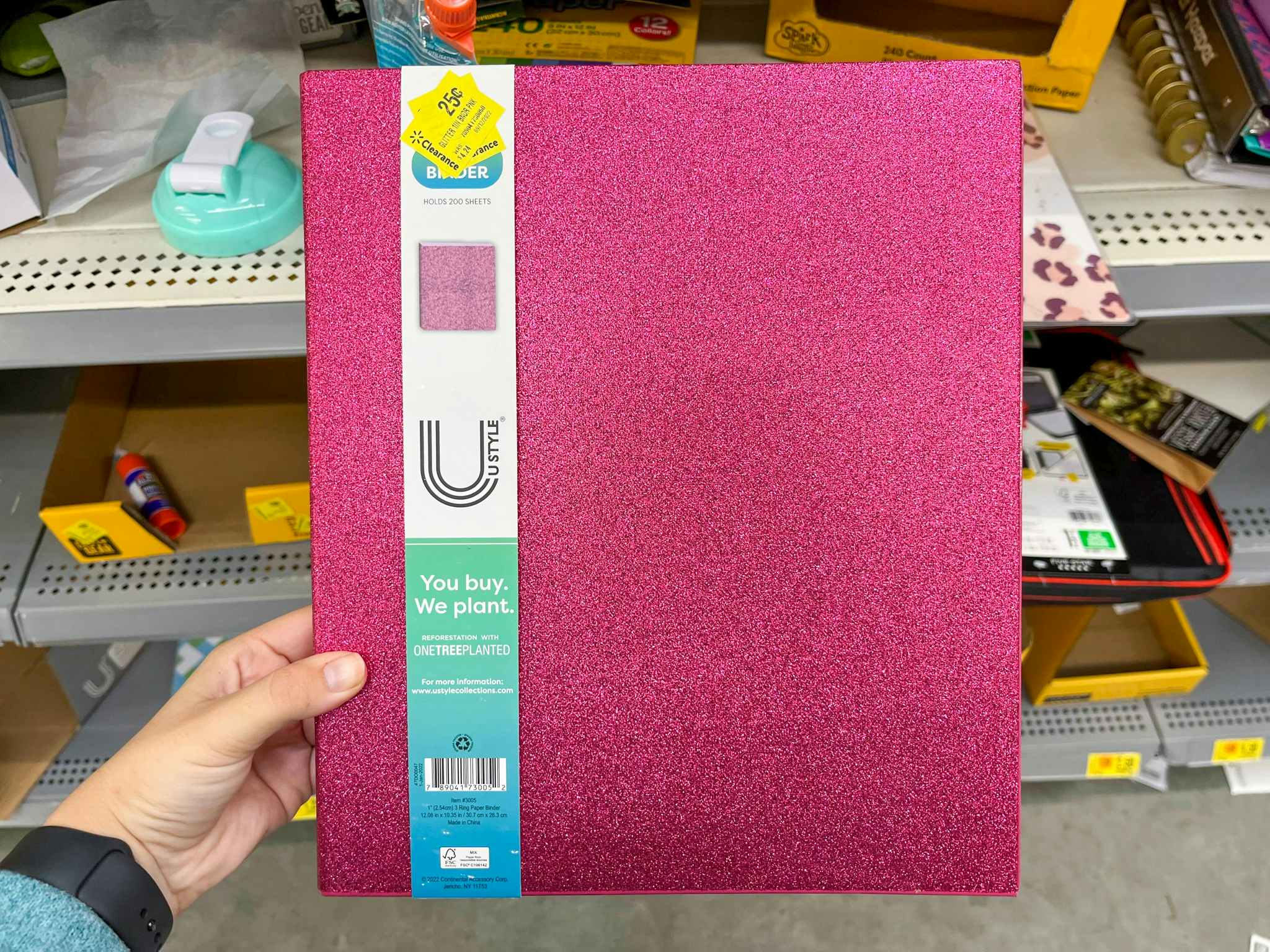 hand holding pen gear pink sparkle binders at walmart