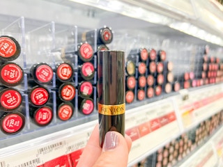 hand holding revlon super lustrous lipstick at walmart