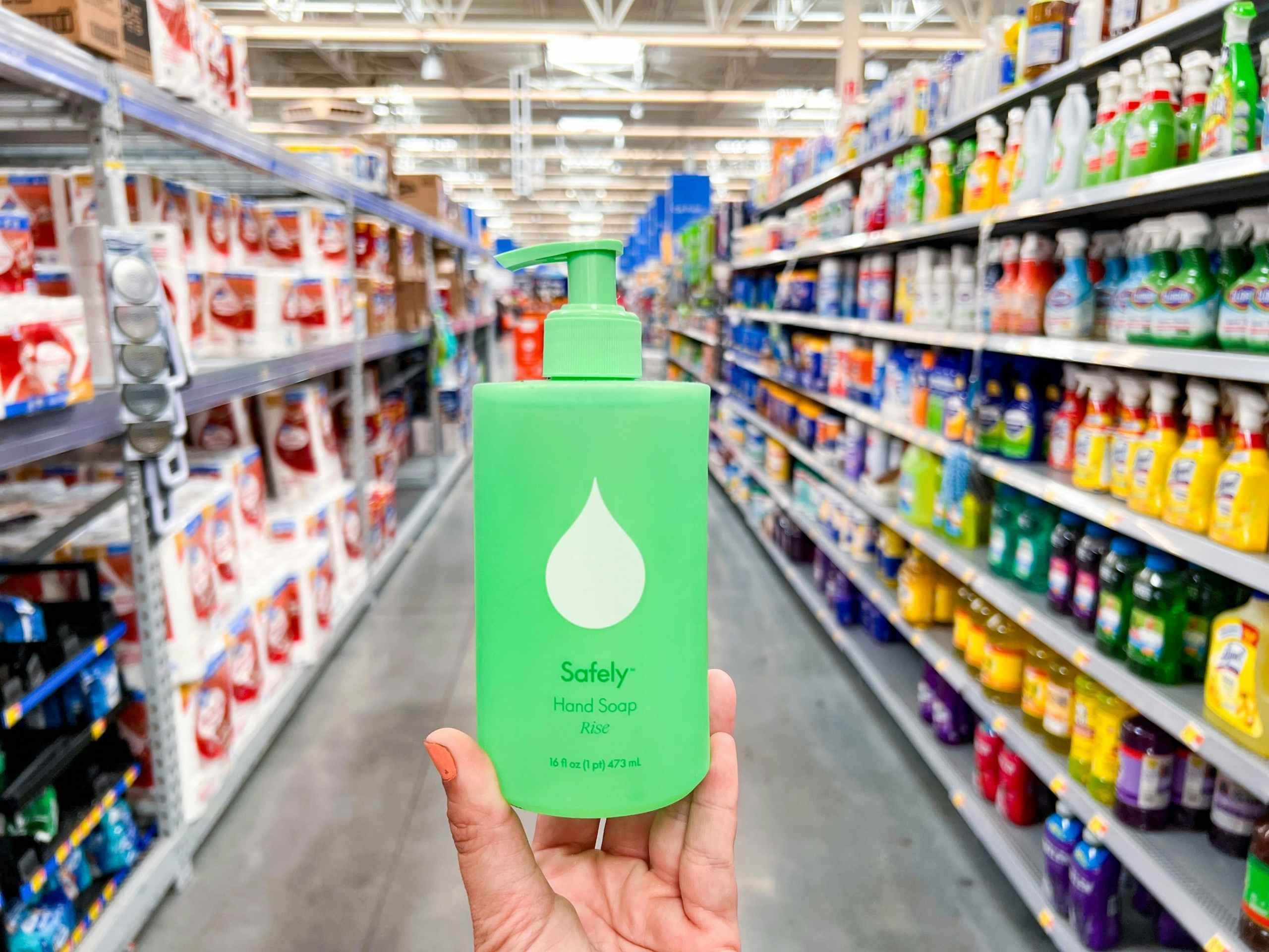hand holding a bottle of Safely hand soap in a Walmart aisle