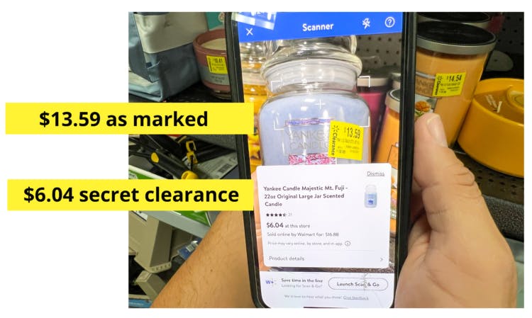 person comparing walmart clearance tag with app price