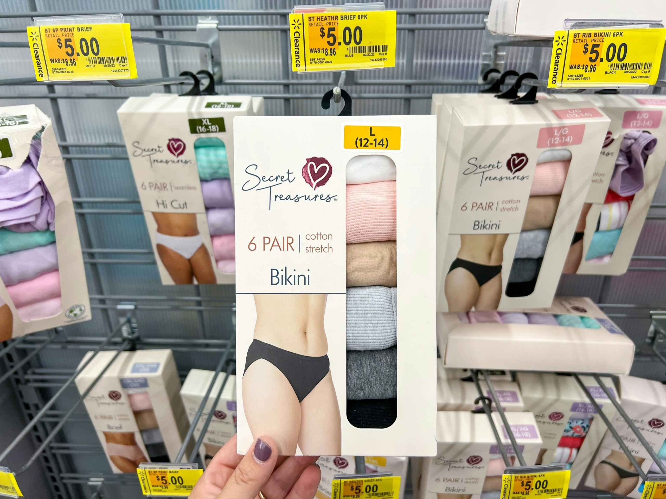 hand holding secret treasures 6 pack bikini panties at walmart