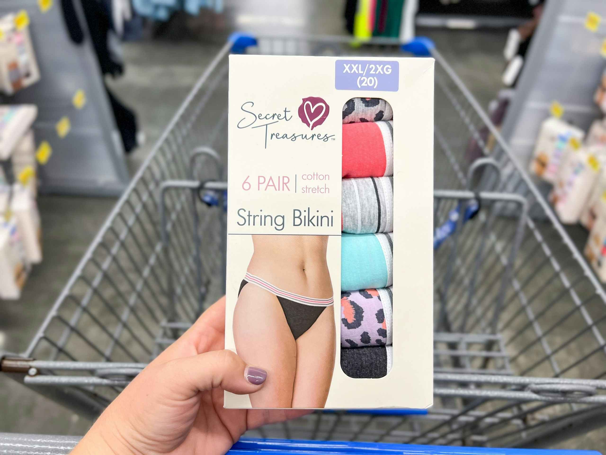 hand holding secret treasures 6 pack string bikini panties at walmart