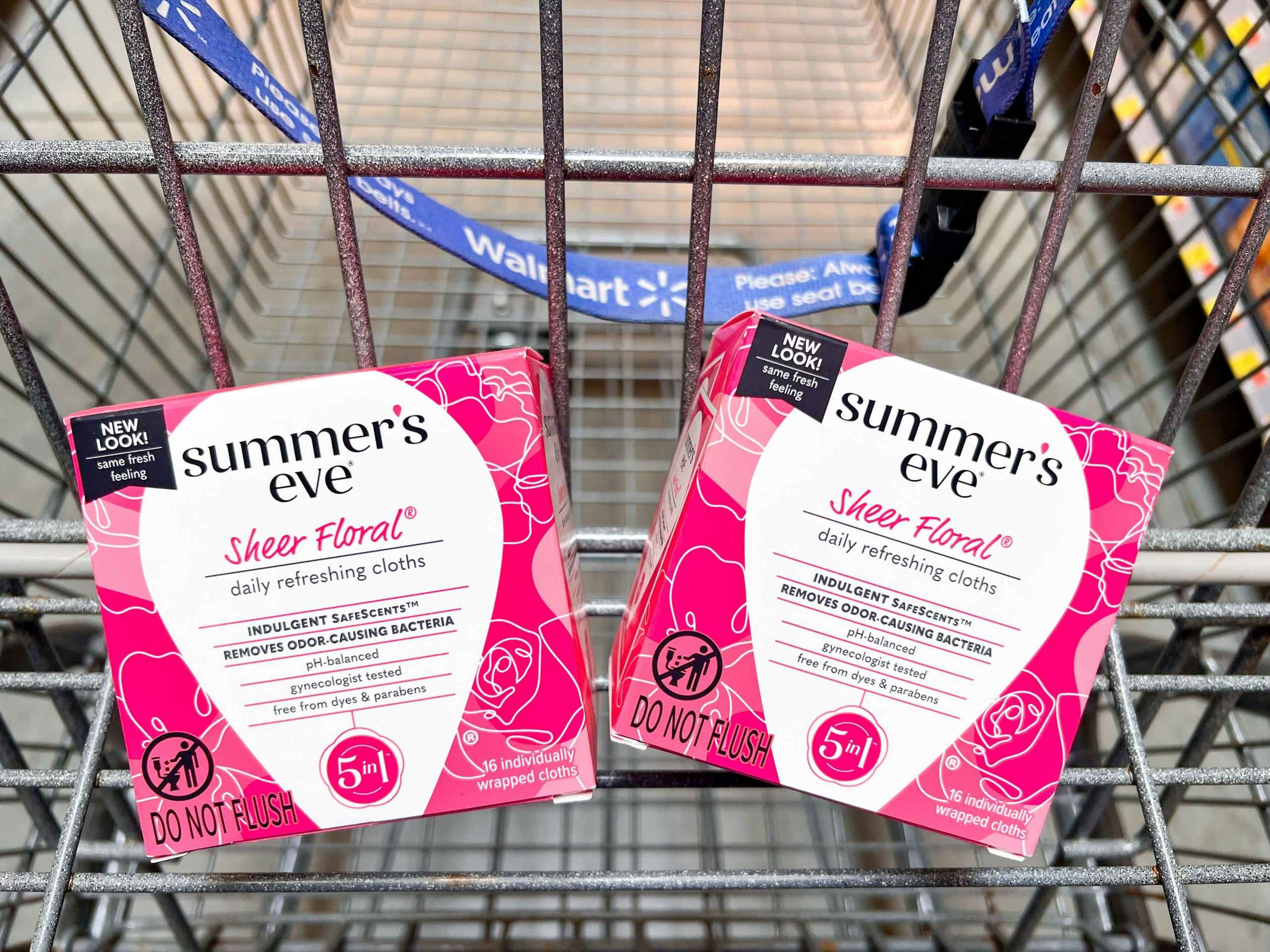 2 boxes of Summer's Eve feminine wipes in a set of a Walmart cart
