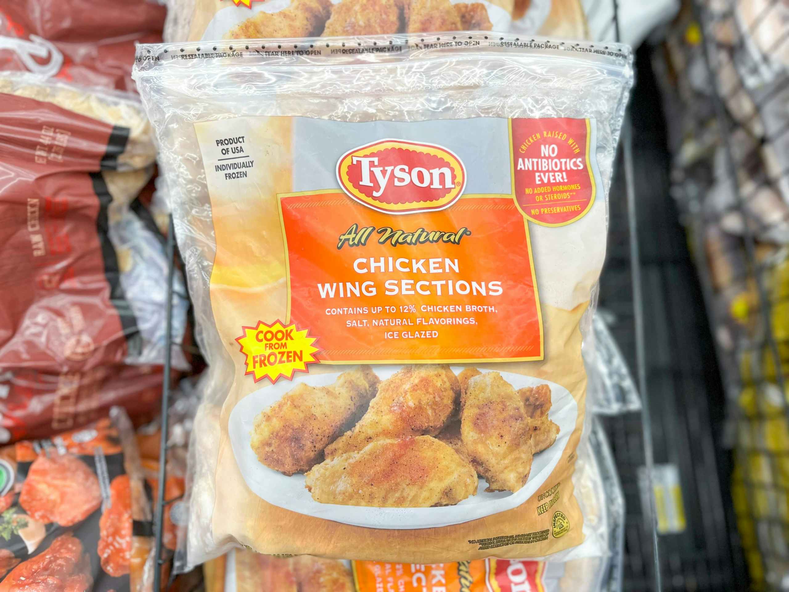 a bag of Tyson chicken wing sections in the cooler at Walmart