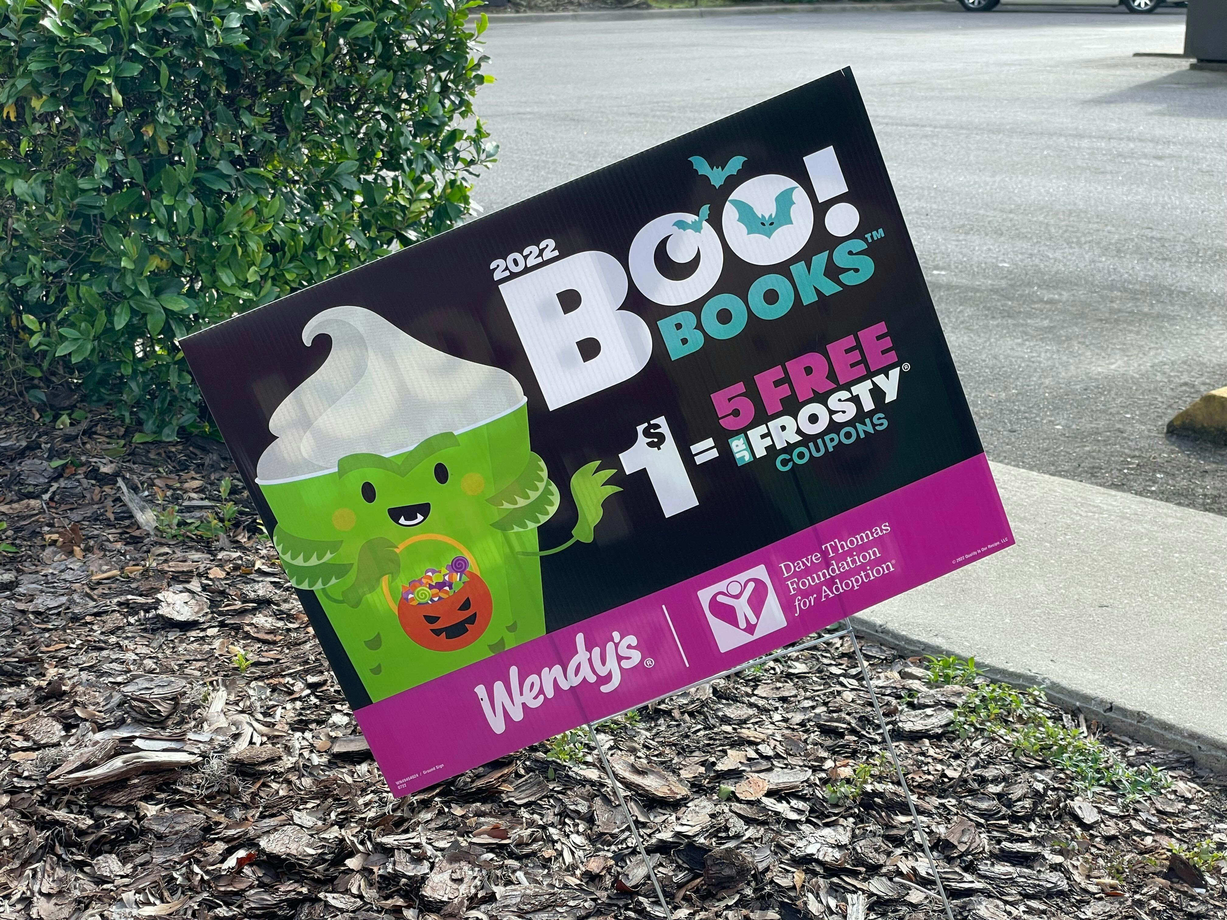 A Wendy's Boo Books advertisement sign outside of the restaurant