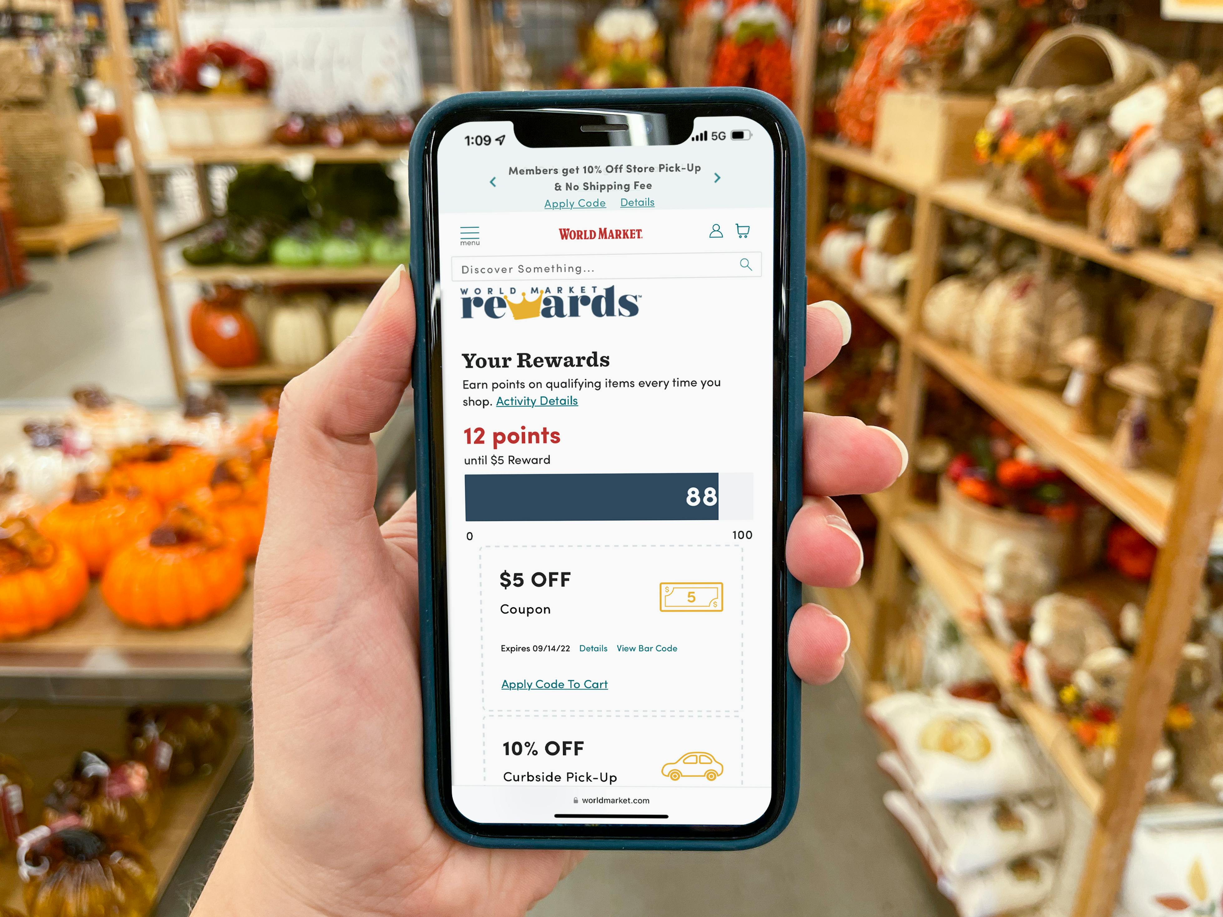 World Market rewards points on a cell phone.