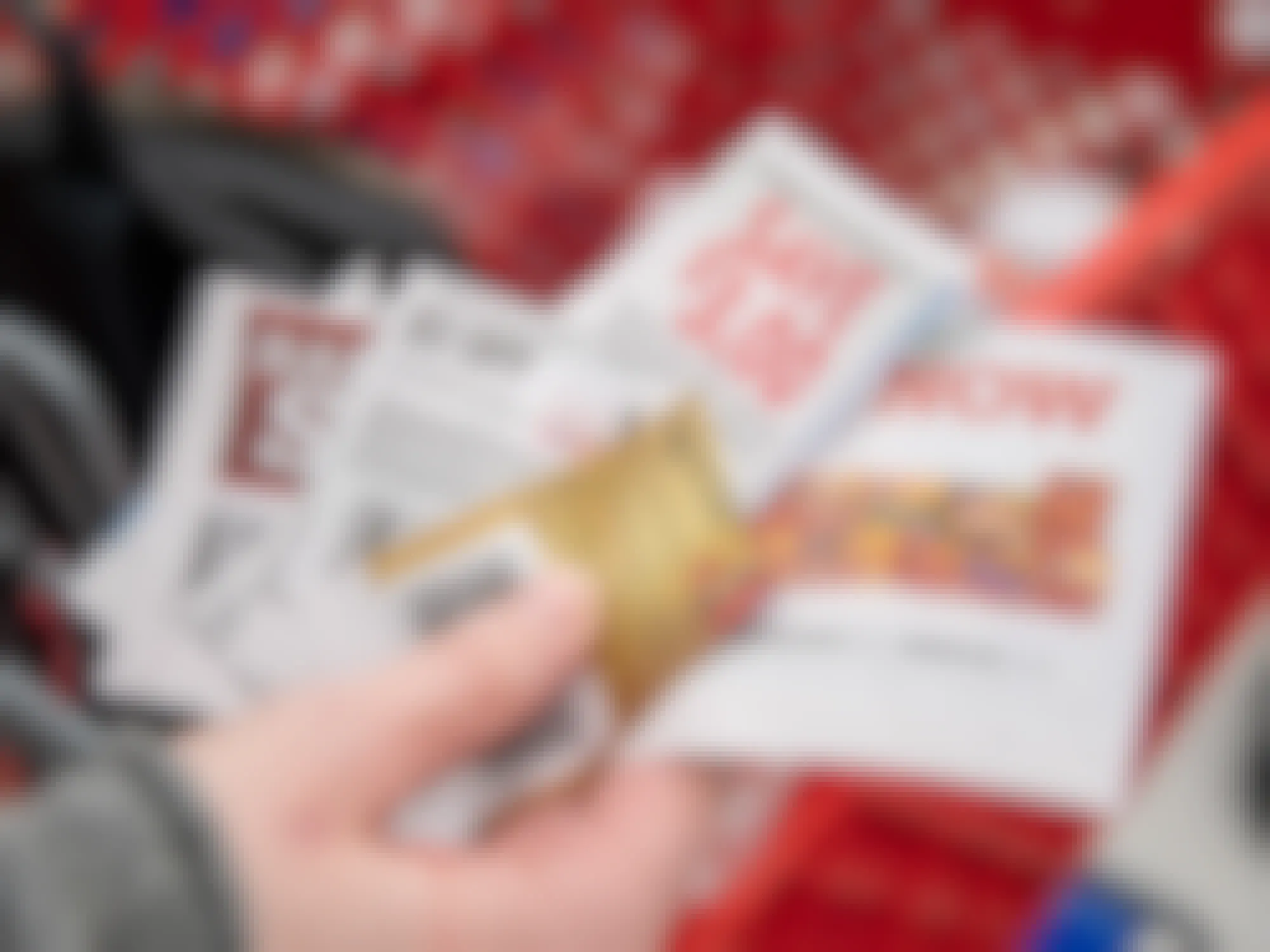 a person holding coupons in a target