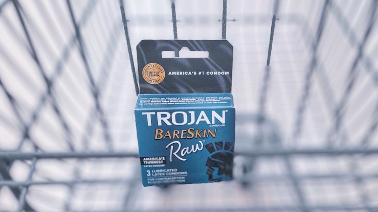 package of condoms in shopping cart