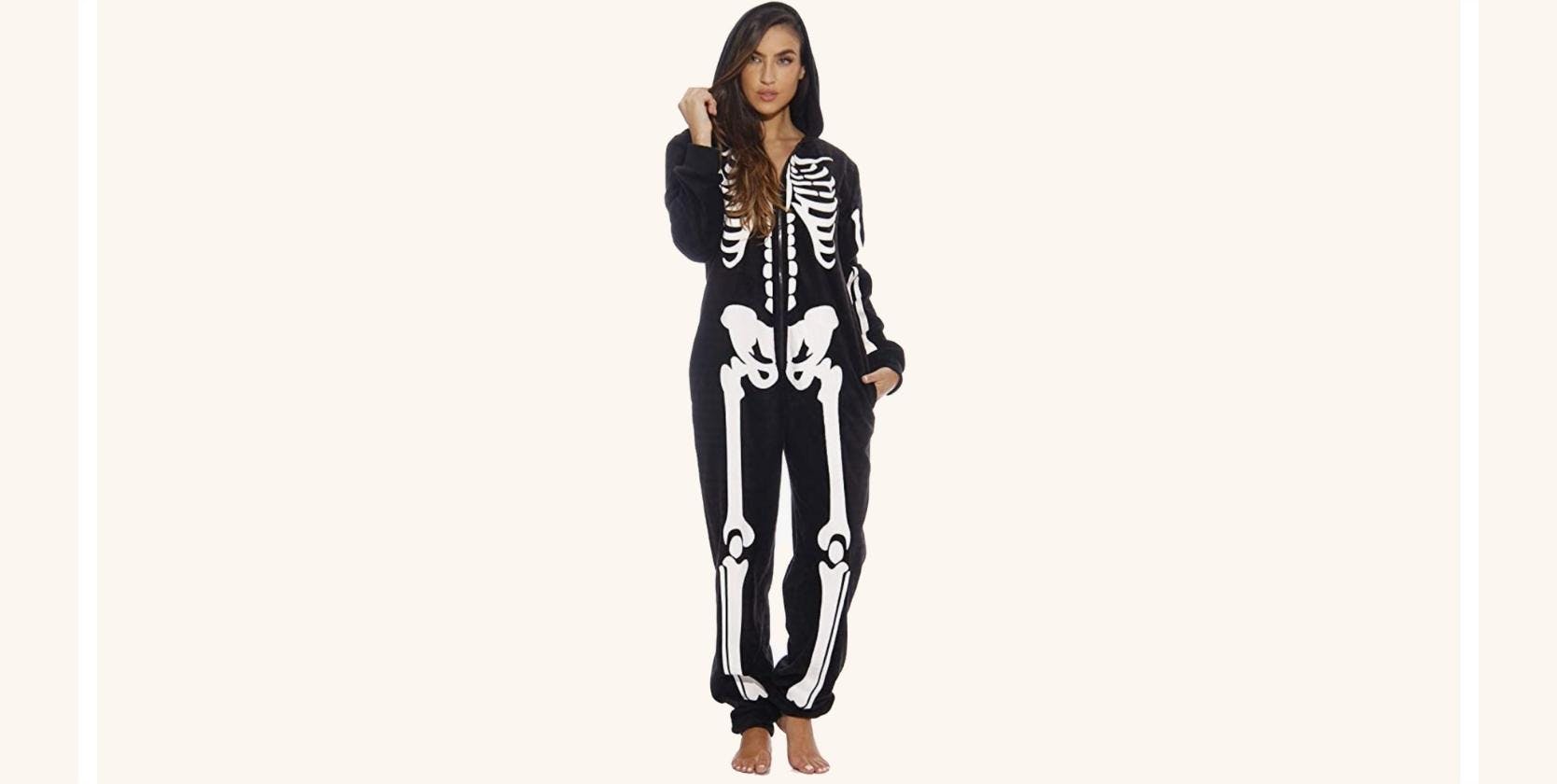 A woman wearing a skeleton onesie.