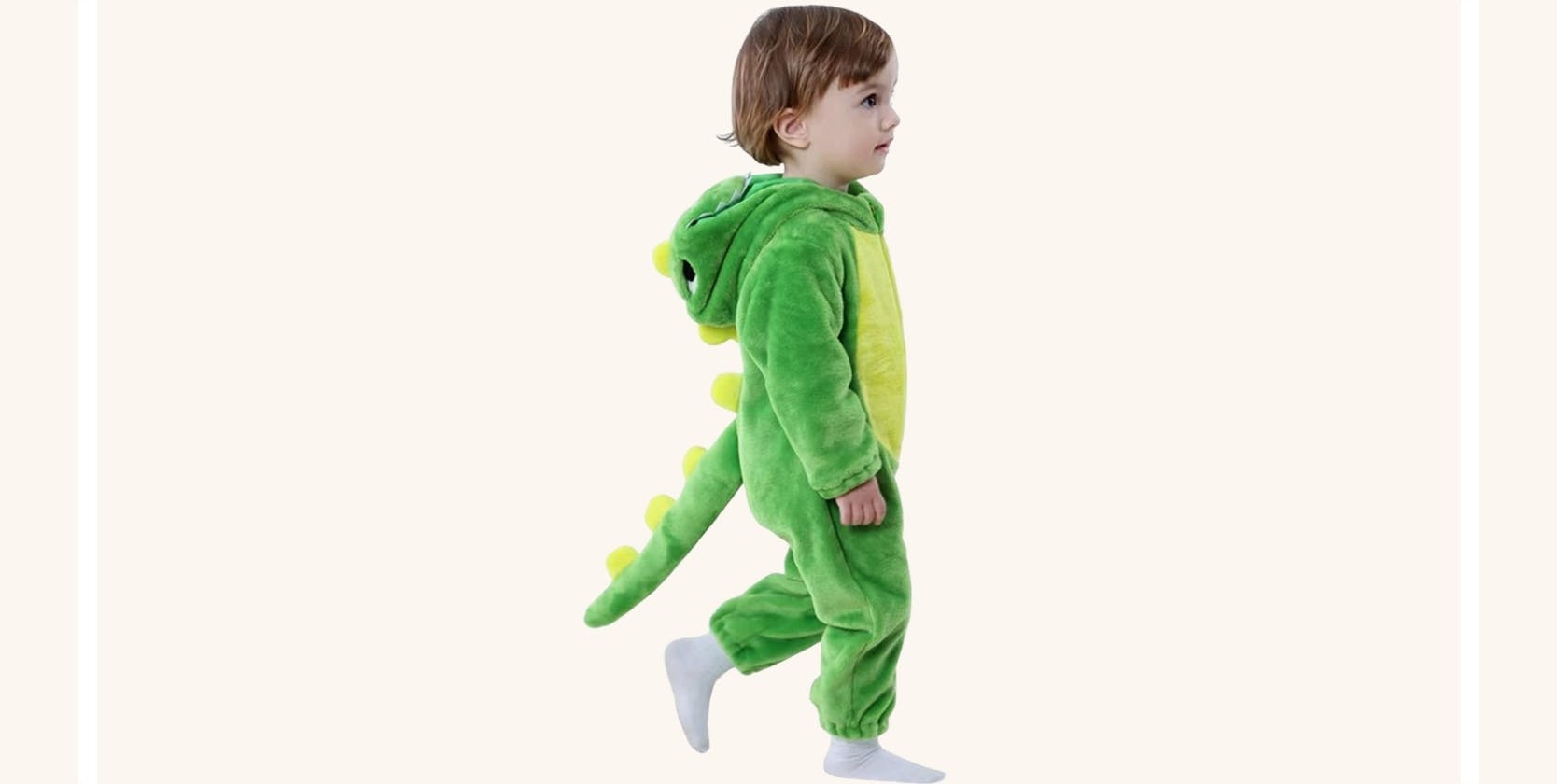 A boy in a dinosaur costume.