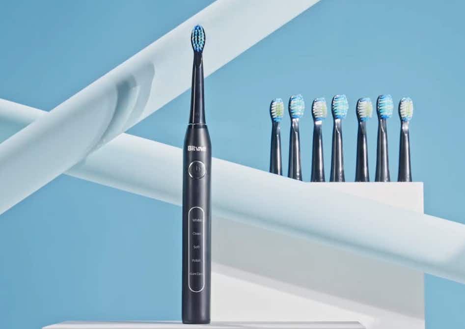 a black sonic toothbrush set with replacement heads