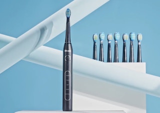 a black sonic toothbrush set with replacement heads