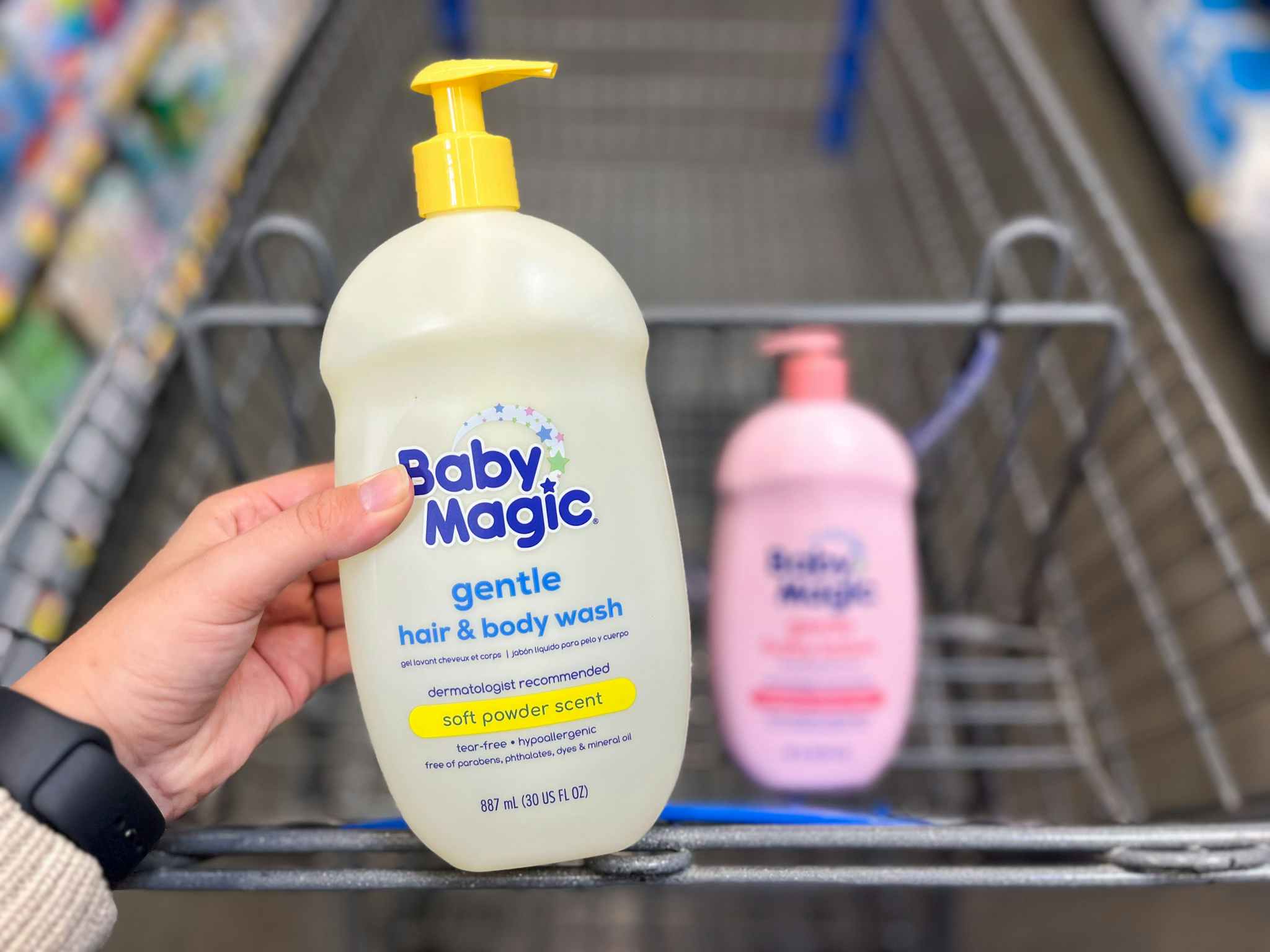 holding up Baby Magic wash at Walmart