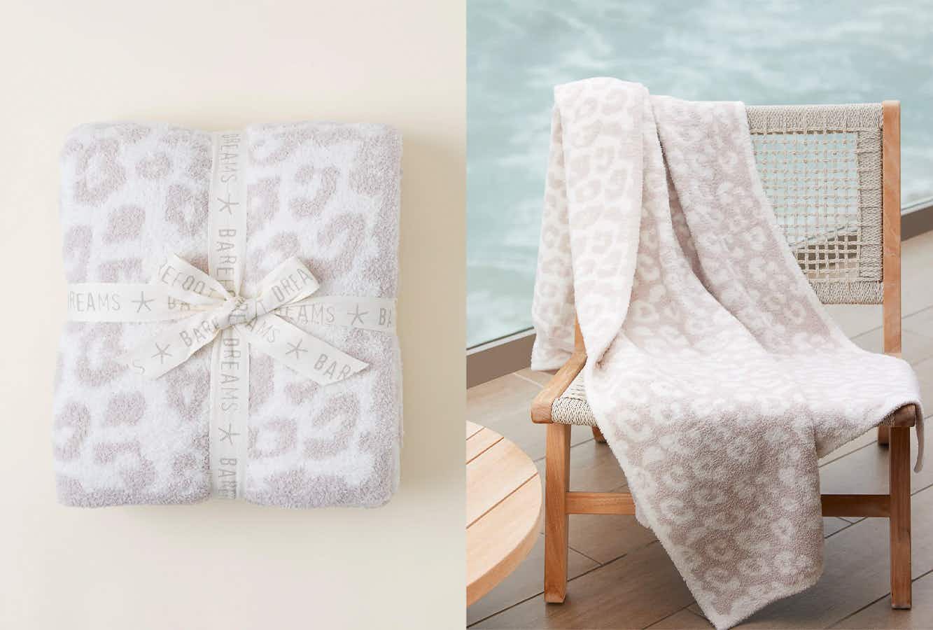 A folded Barefoot Dreams blanket next to one on a chair