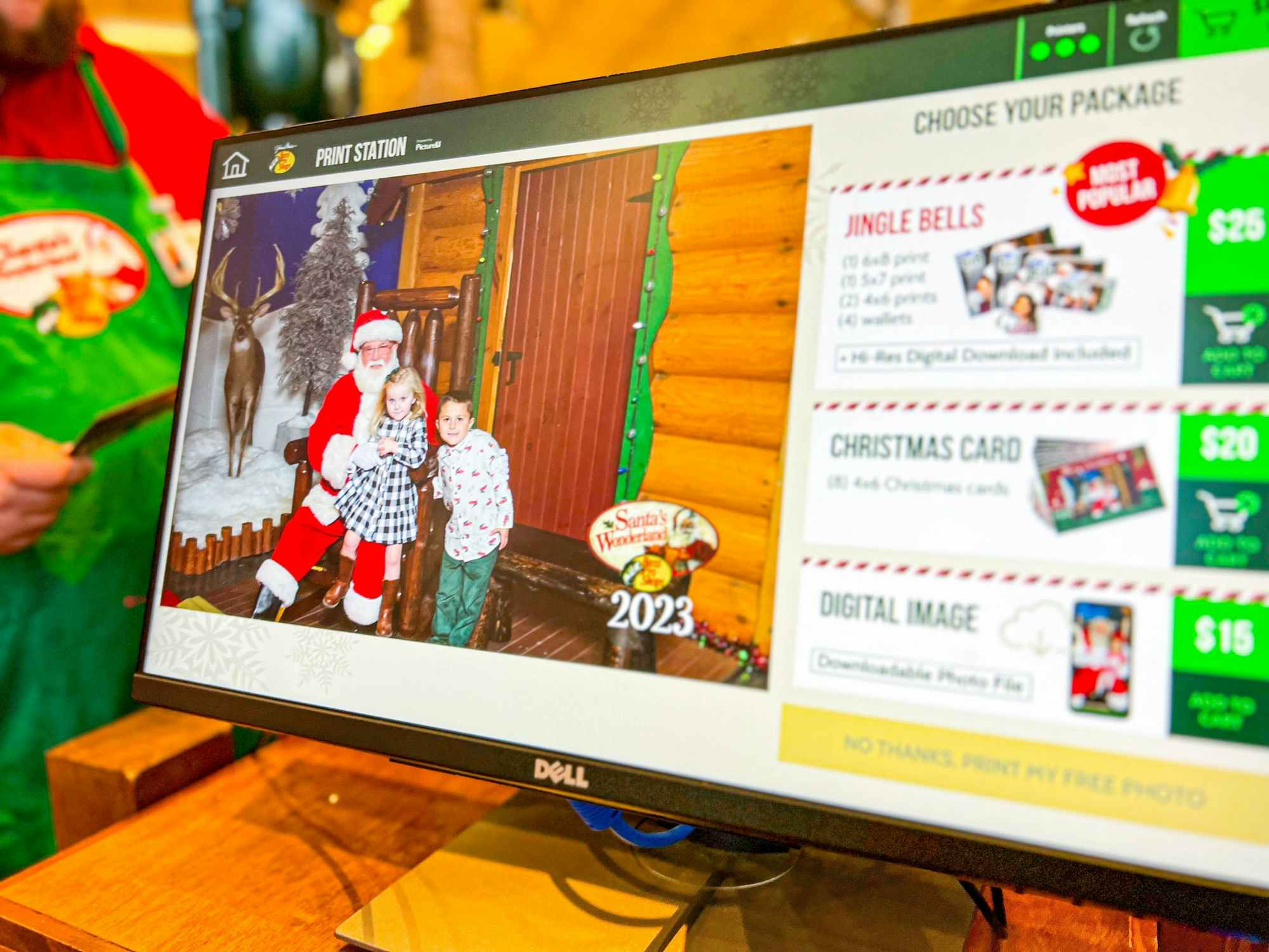 someone ordering a print of a photo of their kids with Santa 
