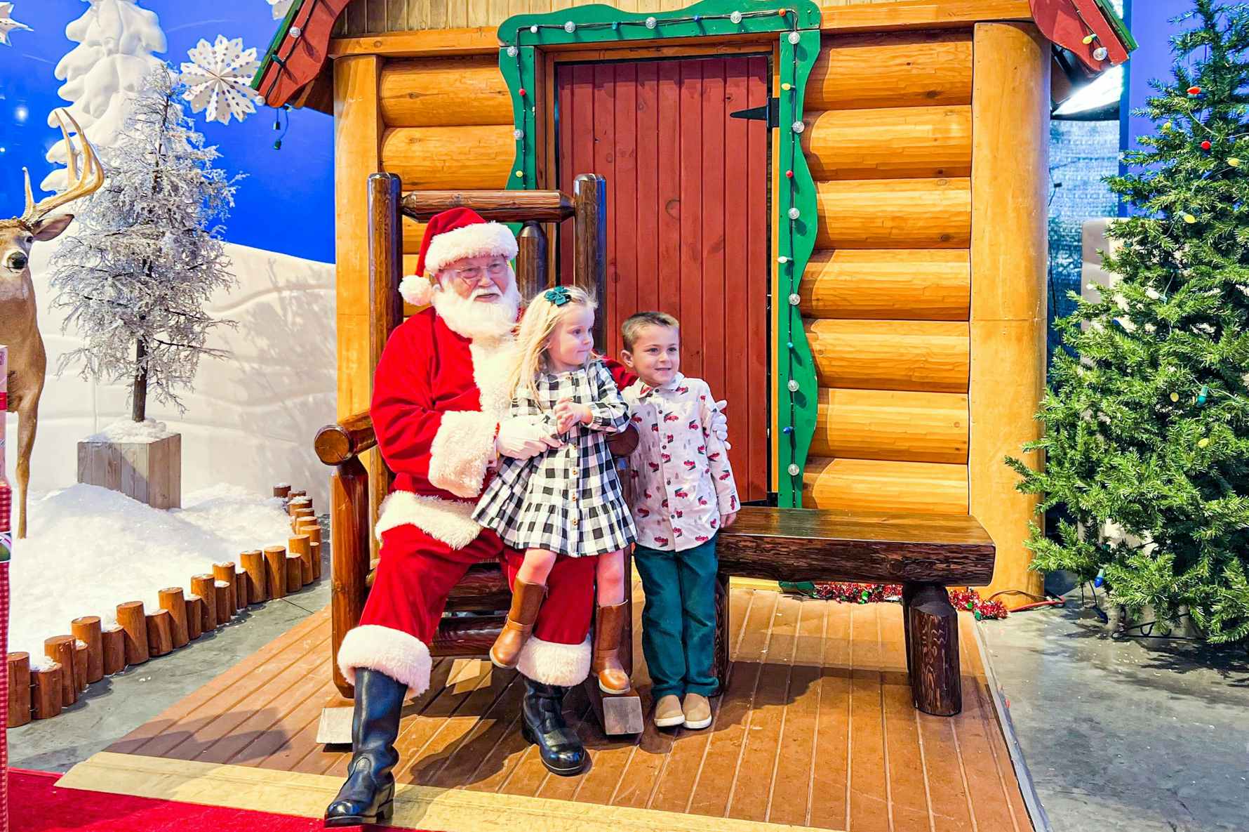two kids next to Santa at Bass Pro Shops