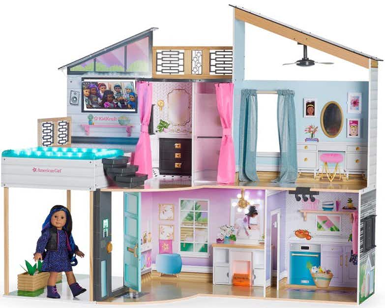 An American Girl x KidKraft Luxury Dollhouse on a white background