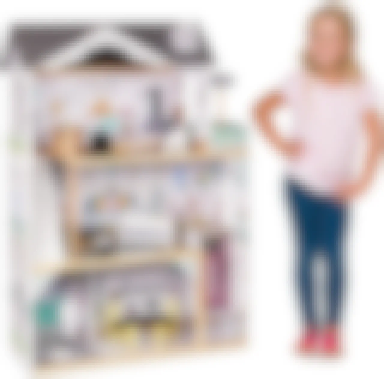 A child standing next to a Lil' Jumbl Kids Wooden Dollhouse