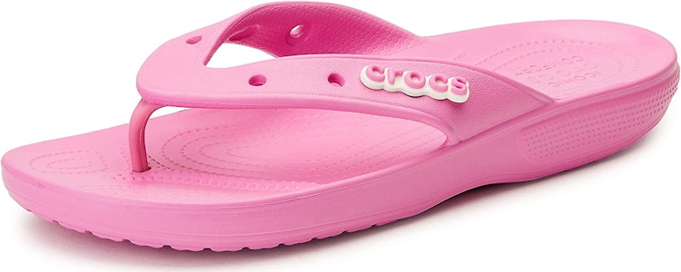 A Crocs flip flop on a white background.