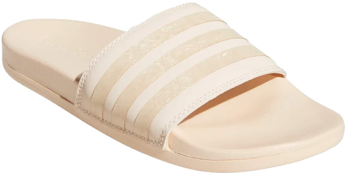 A Adidas Adilette Comfort Slide shoe on a white background.