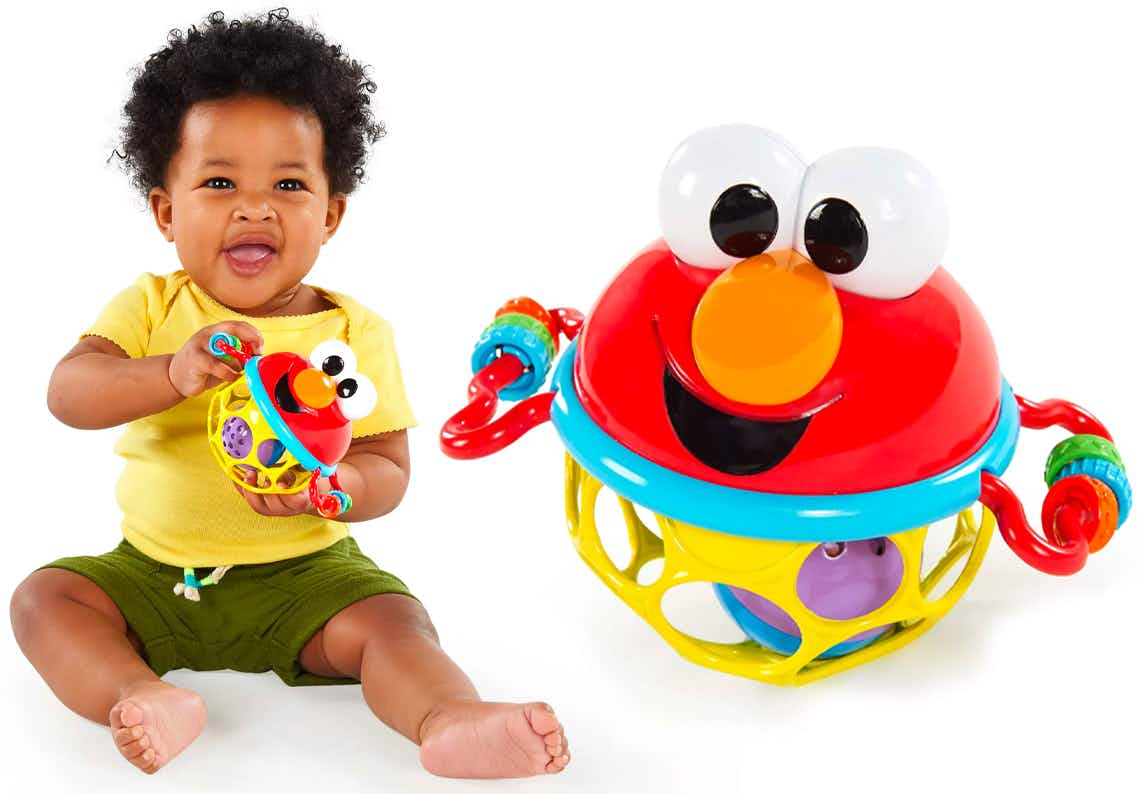 A Bright Starts Sesame Street Jingle & Shake Elmo BPA-free Easy Grasp Baby Rattle and a baby playing with one on a white background.