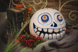 Scary painted and carved pumpkin