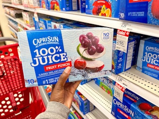 Hand holding a box of Caprisun