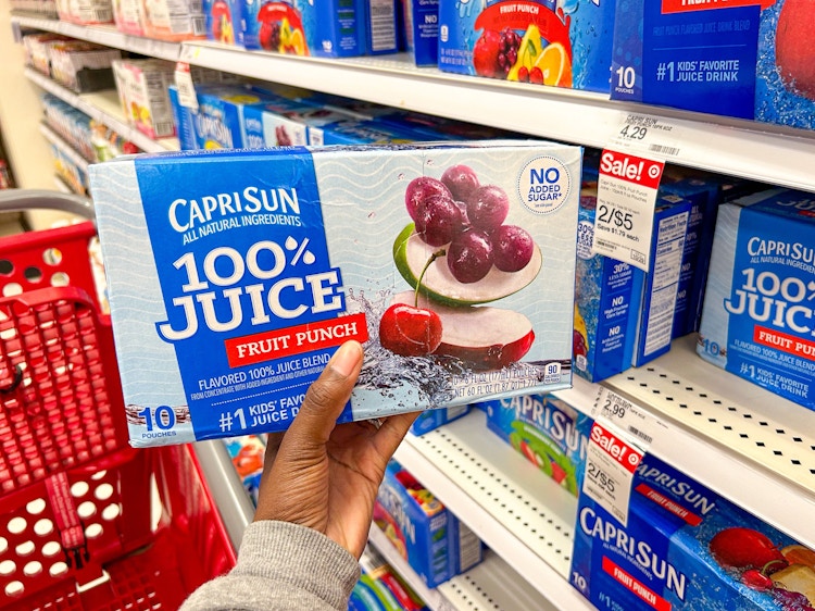 Hand holding a box of Caprisun