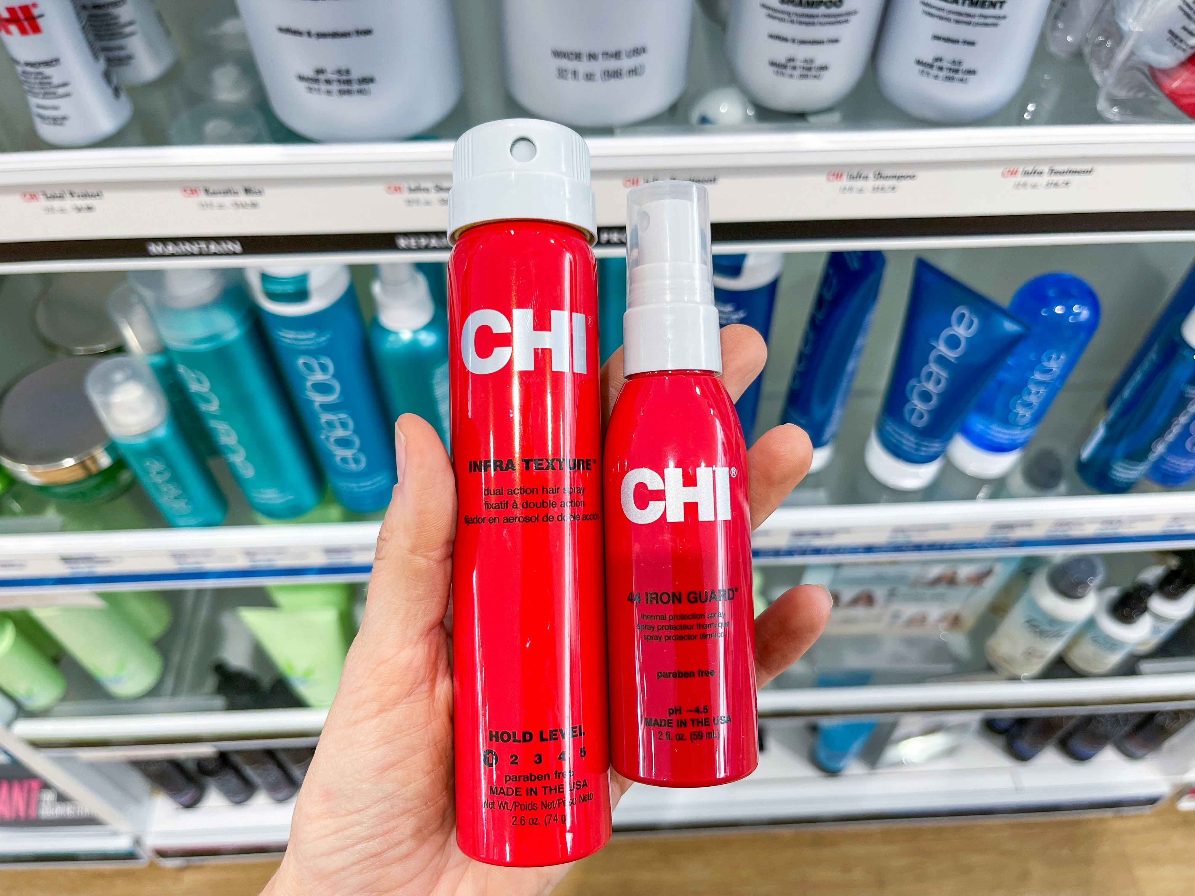 Chi products held out by hand.