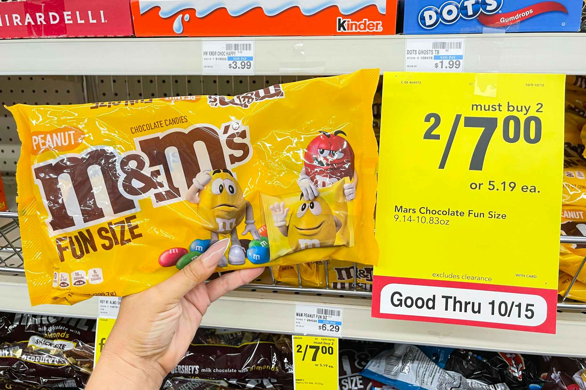 m&m's held next to sale tag