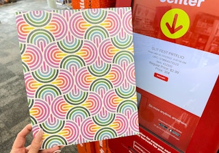 hand holding portfolio next to coupon center