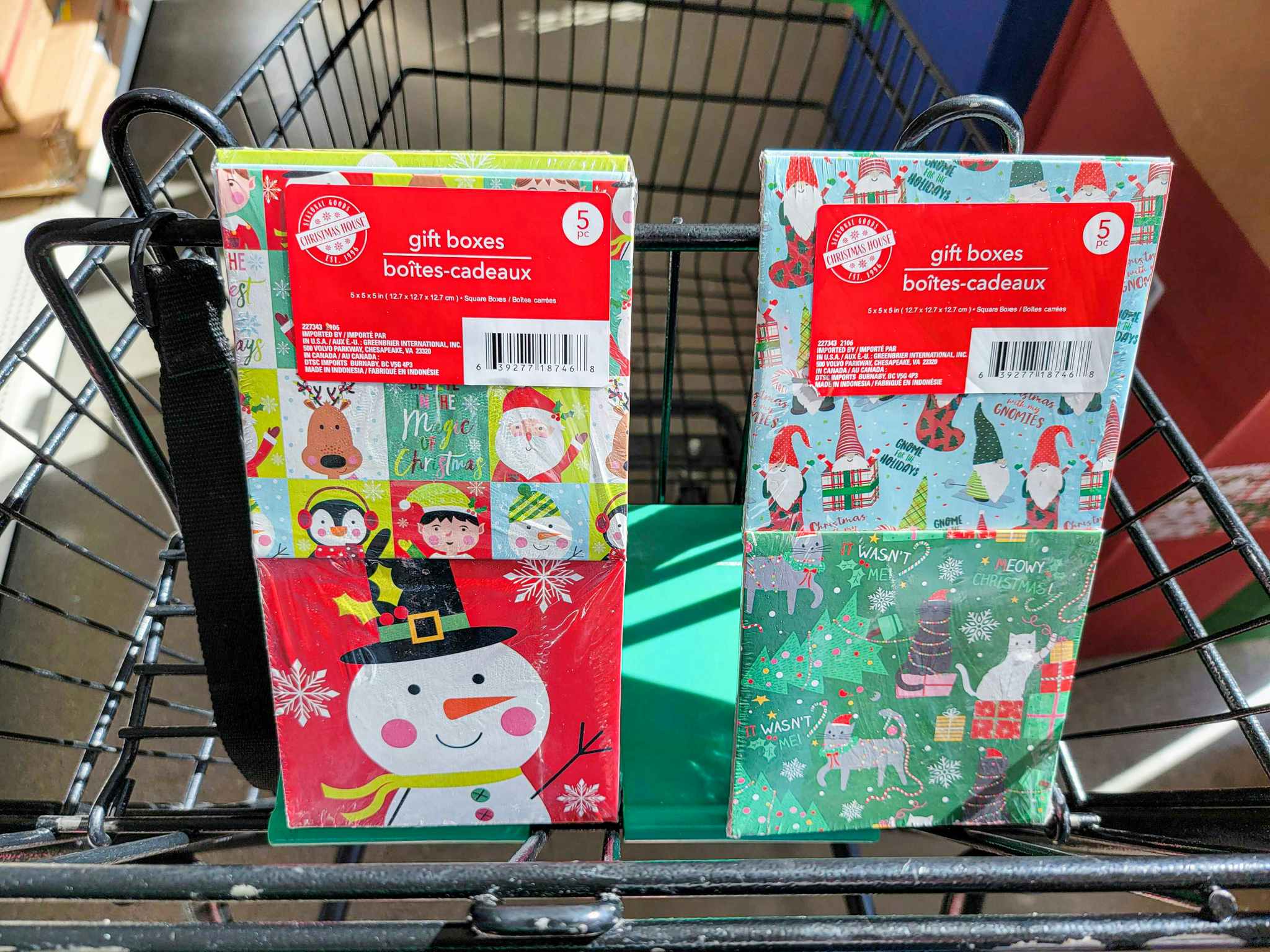 2 packs of small christmas gift boxes in a cart