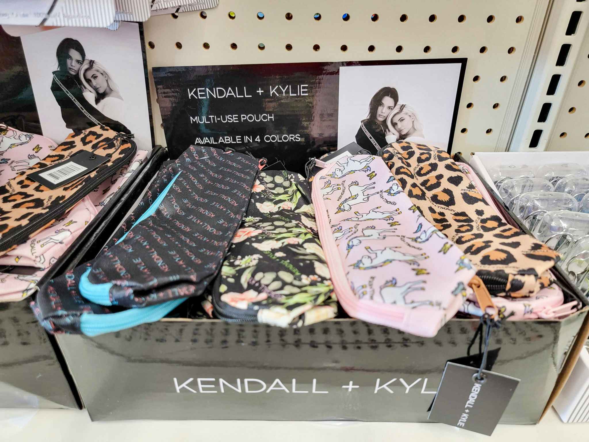 a box with different designs of kendall & kylie cosmetic bags