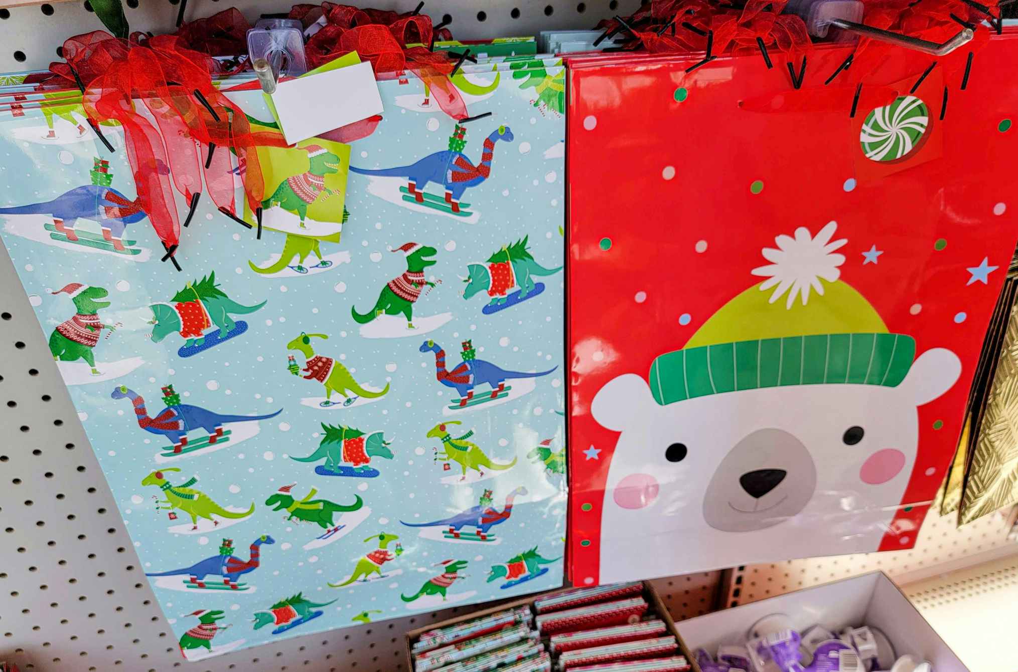 sledding dinosaurs and a polar bear on gift bags