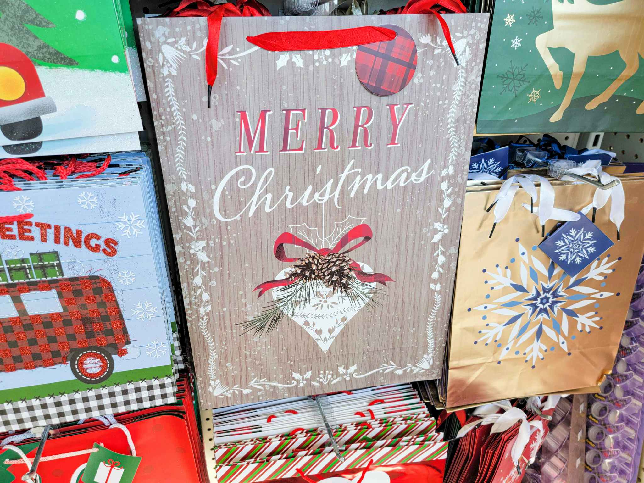brown gift bag that says merry christmas