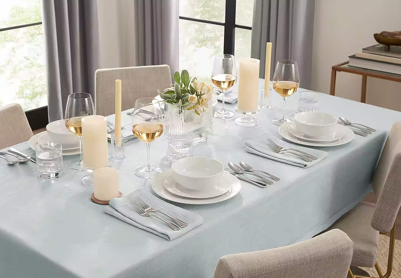 a tablescape featuring a grey herringbone tablecloth