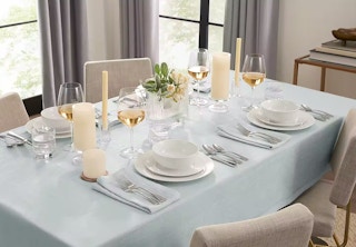 a tablescape featuring a grey herringbone tablecloth