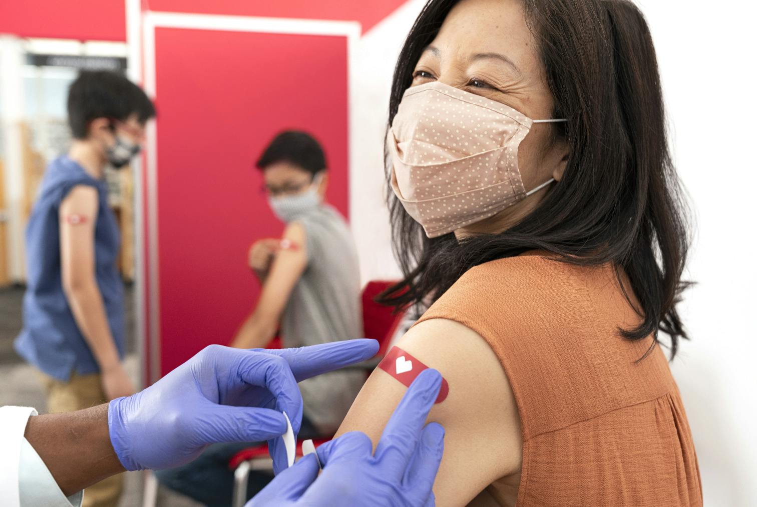 person with bandage after having received flu shot at cvs pharmacy