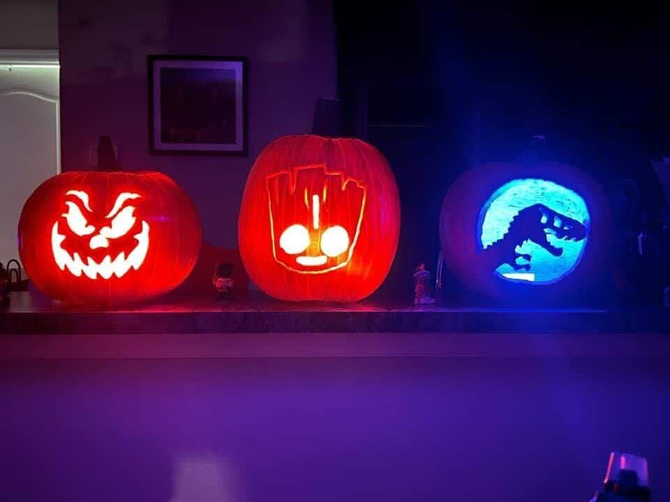 three carved halloween pumpkins