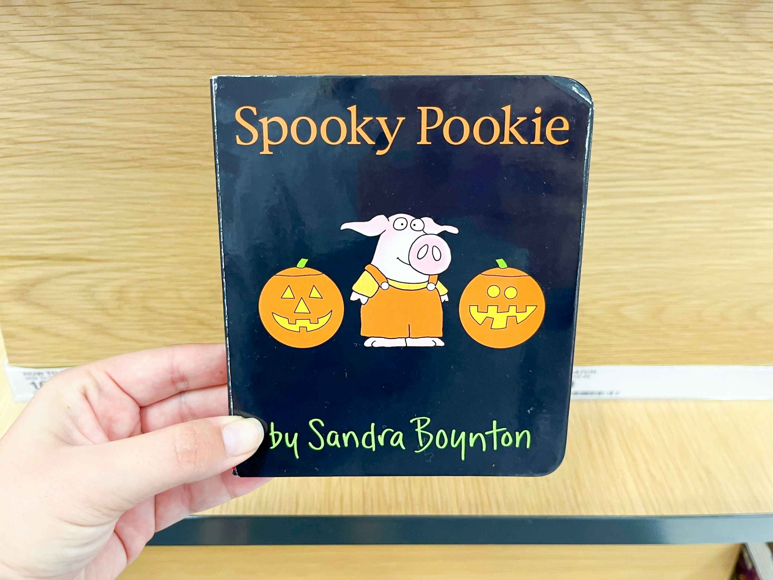 hand holding spooky pookie book