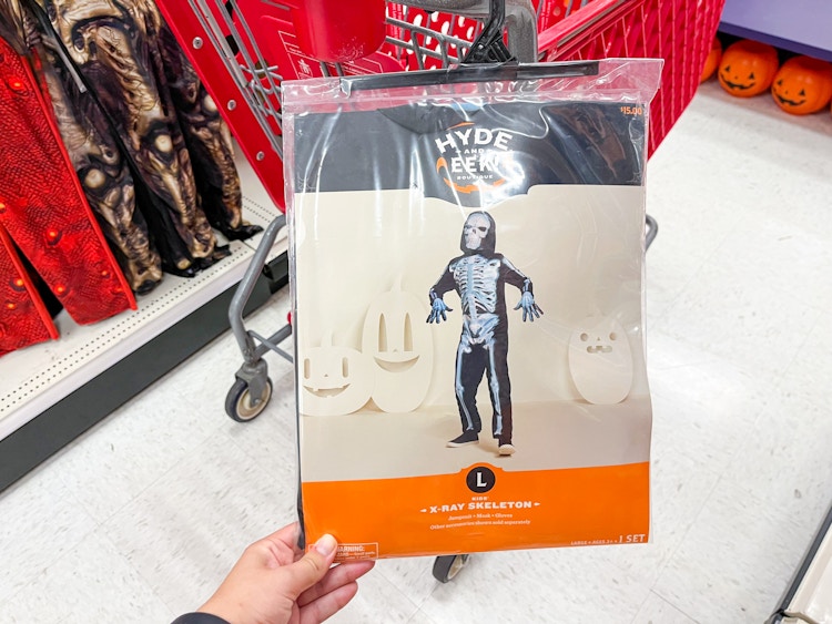 Hand holding a skeleton costume