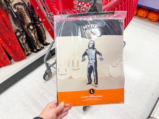 Hand holding a skeleton costume