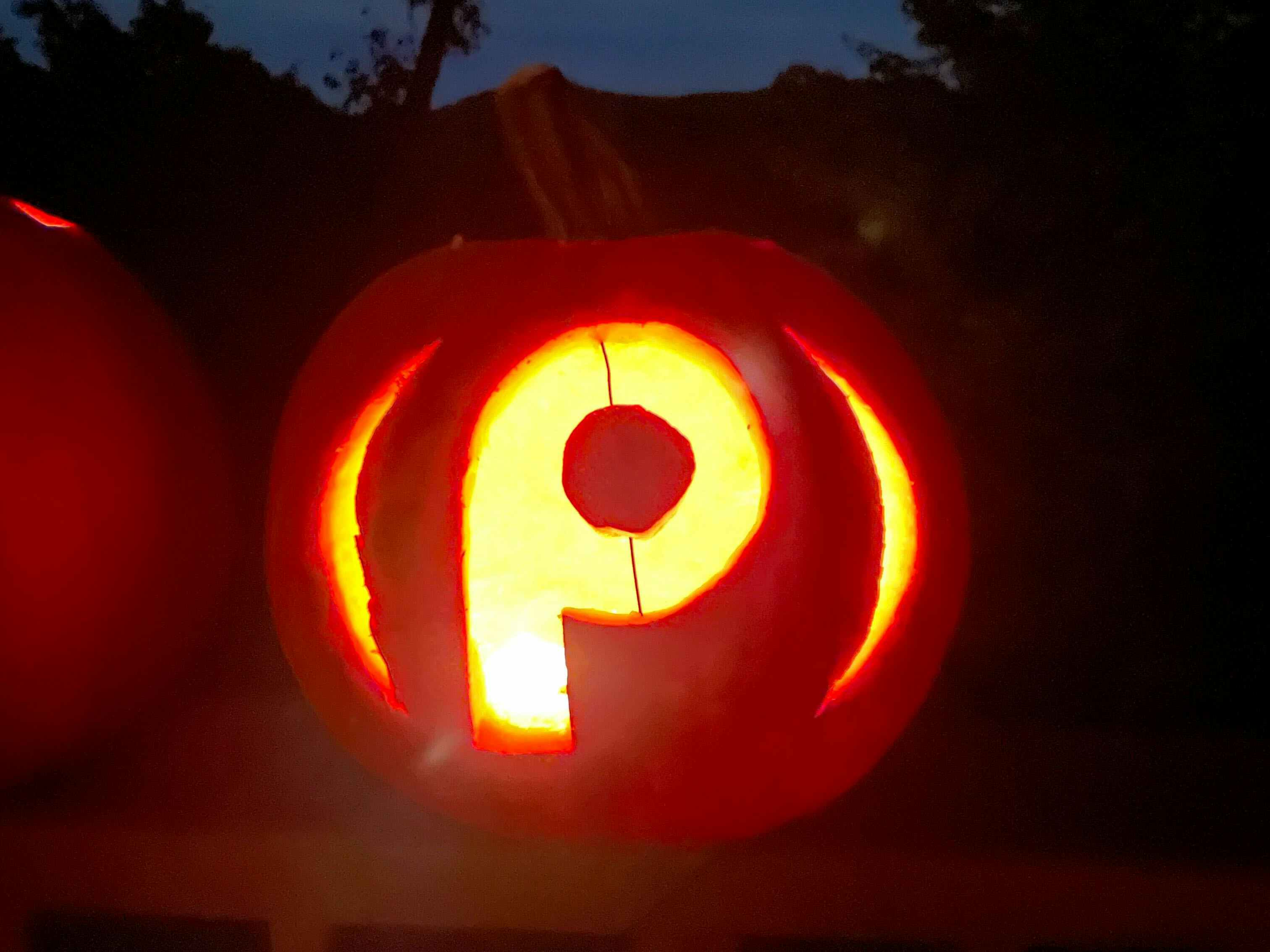 Pumpkin carved with the Publix store logo on it.
