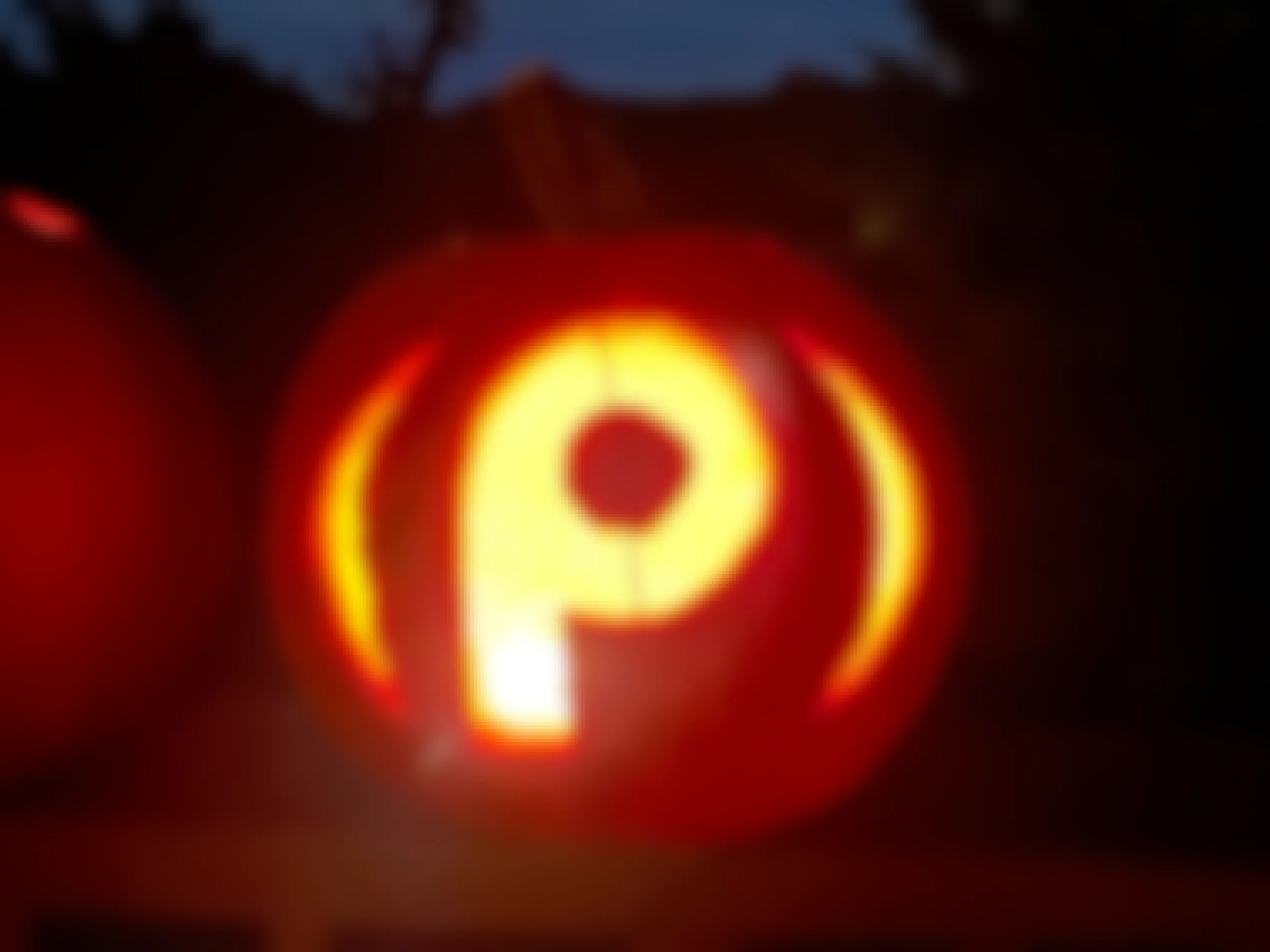 Pumpkin carved with the Publix store logo on it.